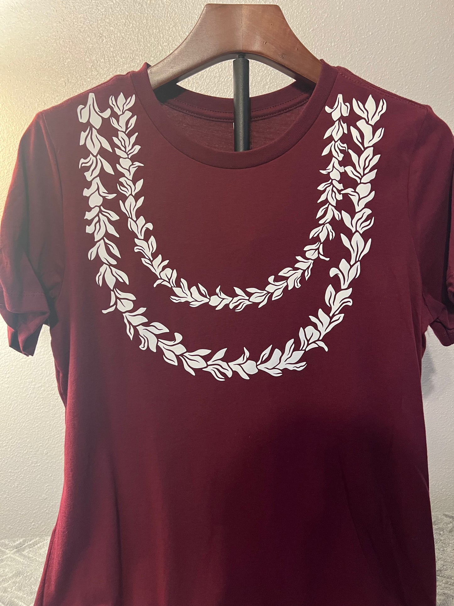Lei Awapuhi in Ke’oke’o on maroon tee
